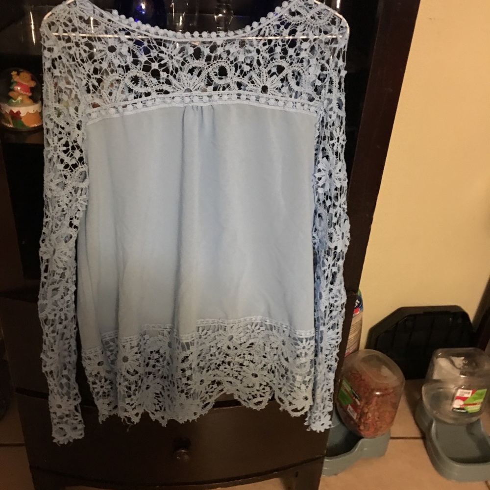 Light Blue lacy blouse in Medium/ Large.